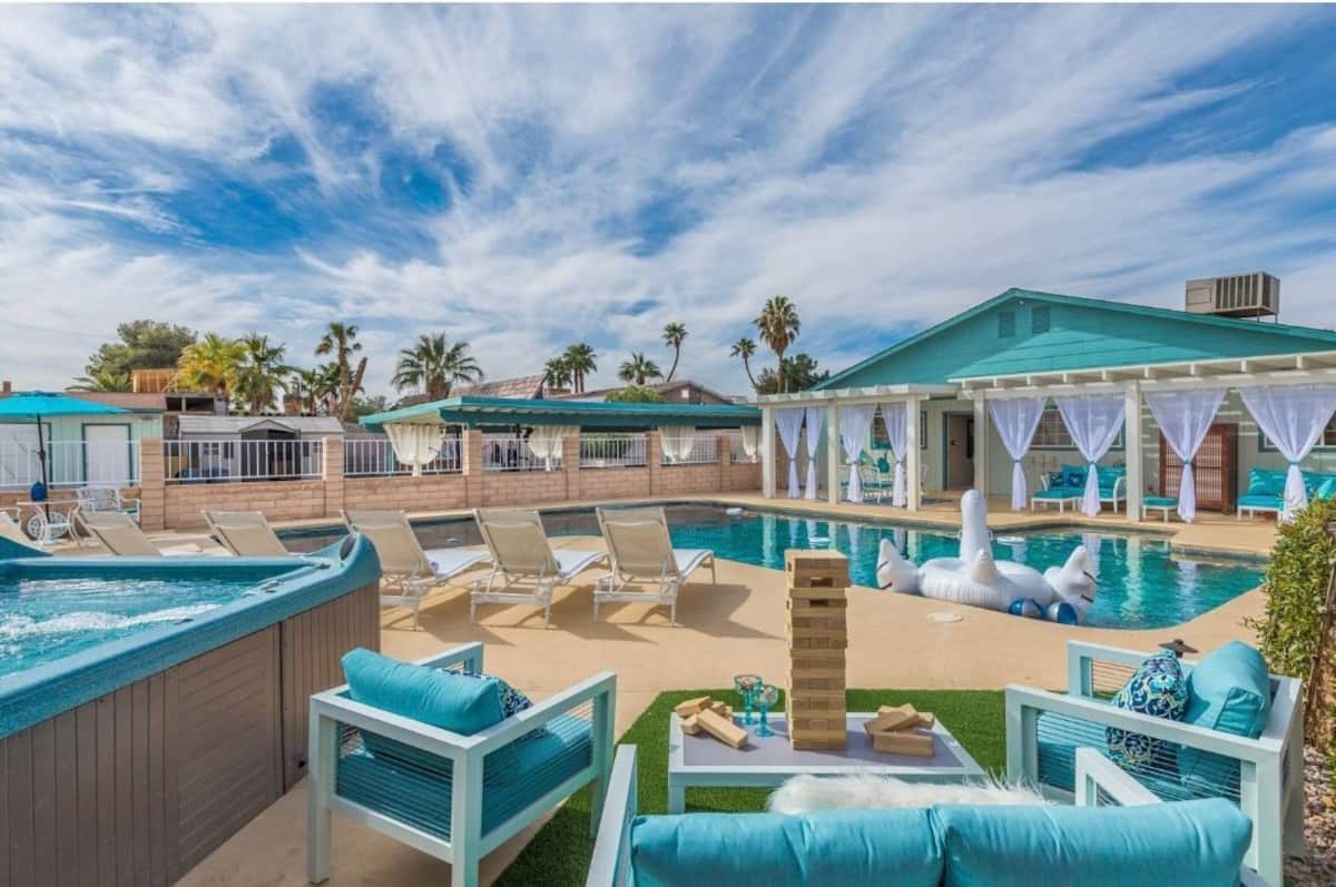 Private pool and hot tub with lounge seating at Spencer Dream Estate in Las Vegas