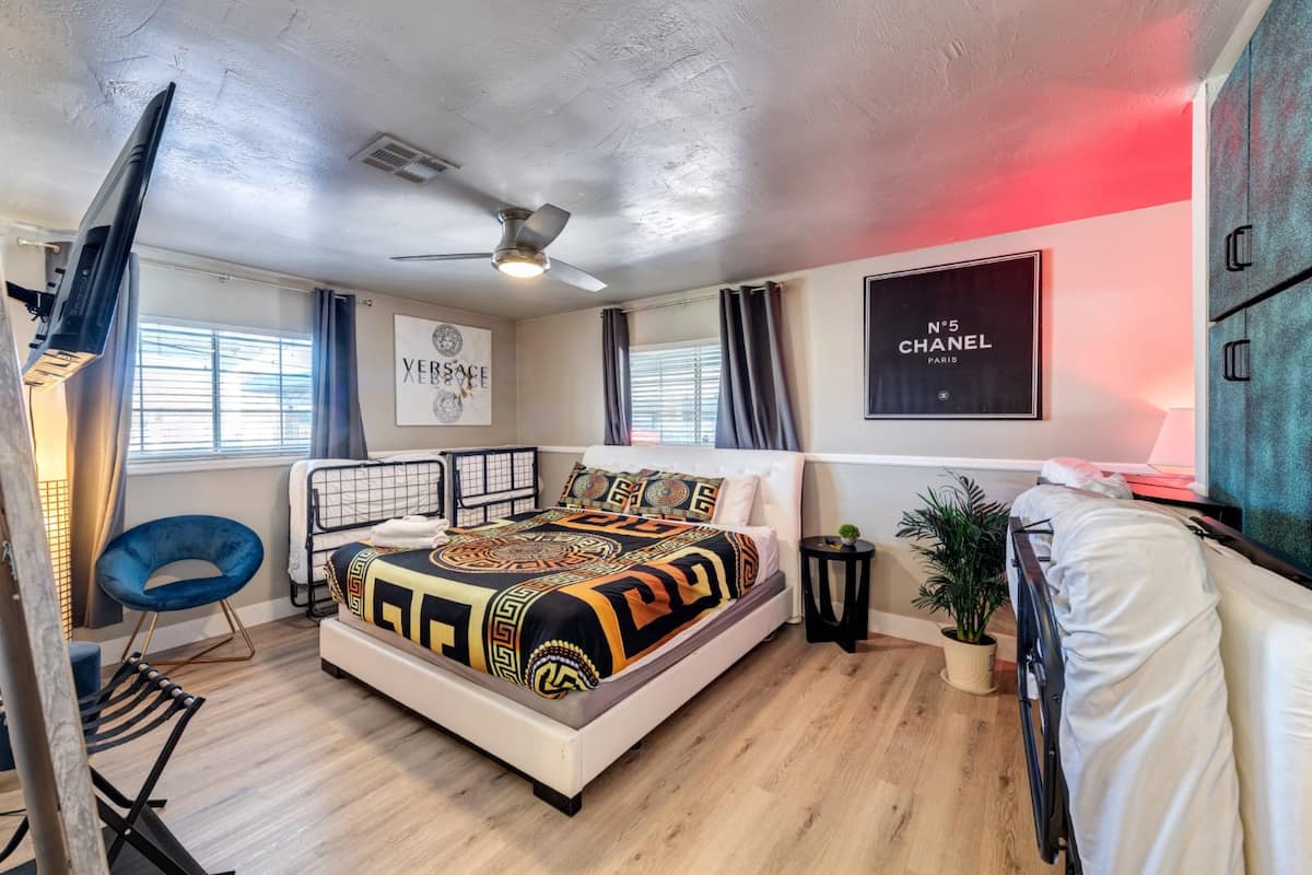 Bedroom with lounge seating and framed wall art at Spencer Dream Estate