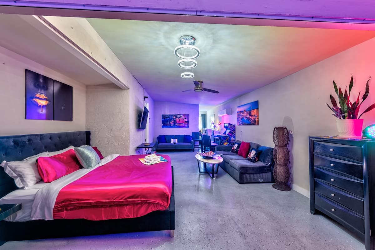 Bedroom with a king bed and lounge seating at Cashman Dream House