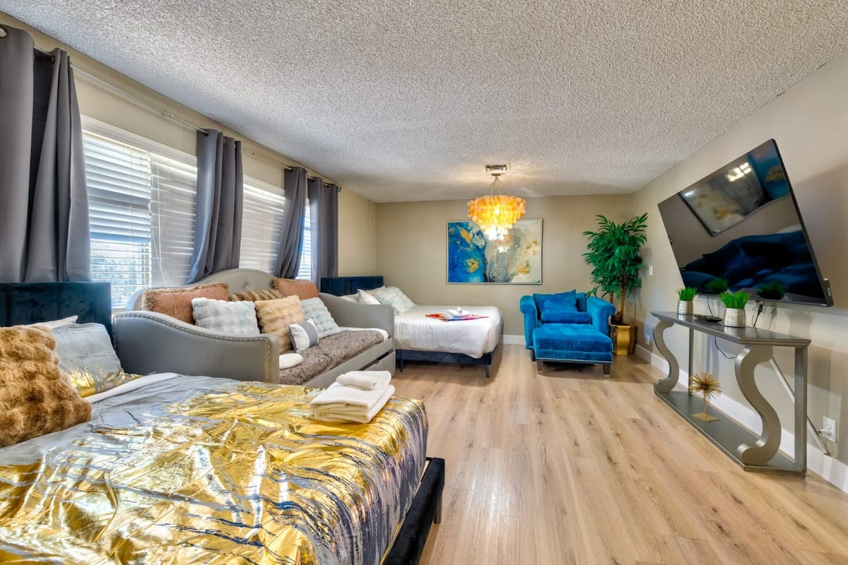 Living area with sofa seating and a large television at Spencer Dream Estate